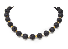 Load image into Gallery viewer, ELISA | Schöne Gem.Chic Unikat Halskette aus Lava in Kugelform mit goldfarbenen Zwischenteilen aus Pyrit
