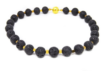 Load image into Gallery viewer, ELISA | Schöne Gem.Chic Unikat Halskette aus Lava in Kugelform mit goldfarbenen Zwischenteilen aus Pyrit
